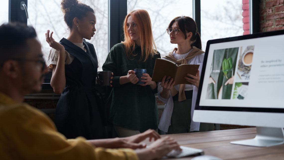 women talking to each other in an office