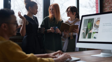 women talking to each other in an office