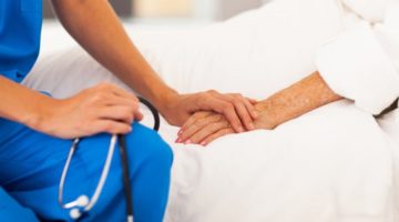 nurse holding hand of patient