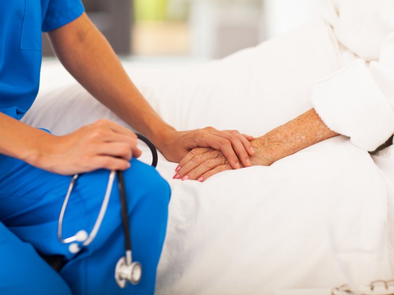 nurse holding hand of patient
