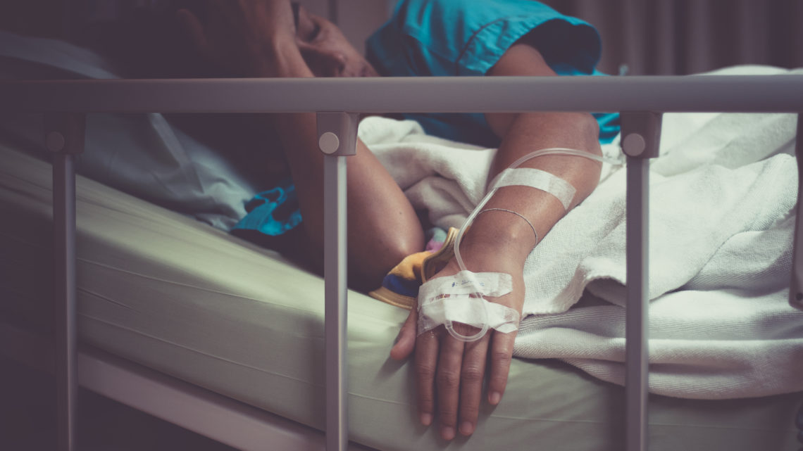 woman sick with salmonella poisoning in hospital bed