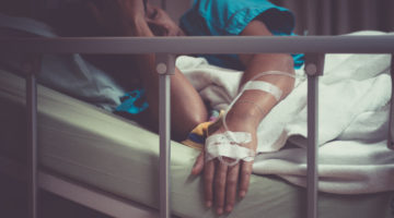 woman sick with salmonella poisoning in hospital bed