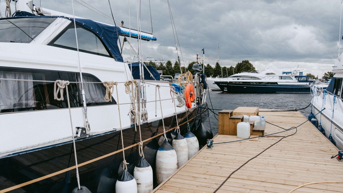 A boat is docked at a pier during a storm