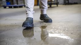 Personal stepping on puddle