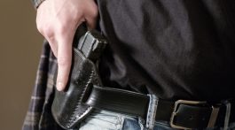 Man with gun in armed robbery.