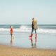 child & mom on a beach