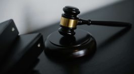 A desk and gavel representing the crackdown on personal injury lawsuits in Georgia