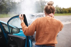 Read end car accident with women grabbing her neck